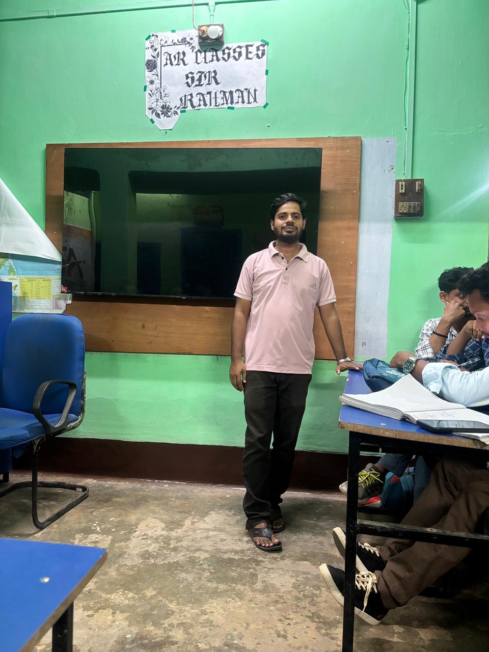 Sir Rahaman teaching students at AR Classes